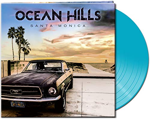 "Blue vinyl record with album cover featuring a classic car and beach scene."