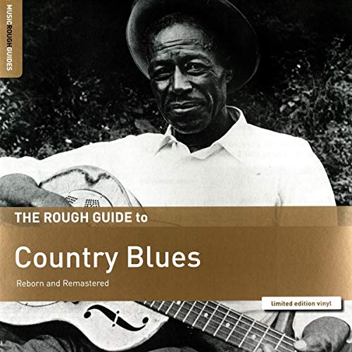 "Album cover with a black-and-white photo of man playing guitar, hat, and brown banner."