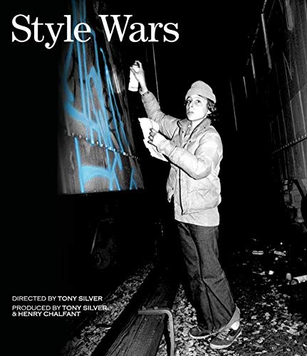 Style Wars" Blu-ray cover: a graffiti artist sprays blue paint on a wall.