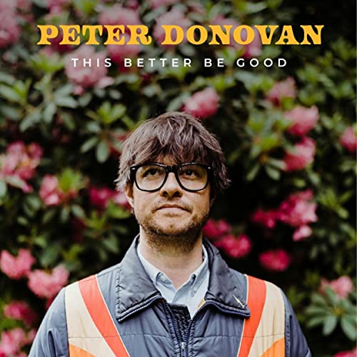 CD cover featuring Peter Donovan, a man with glasses, in front of flowers.