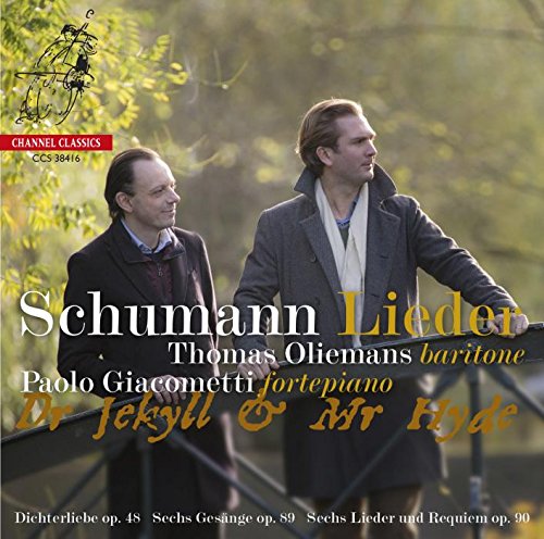 "CD cover with two men standing on a bridge, outdoors."