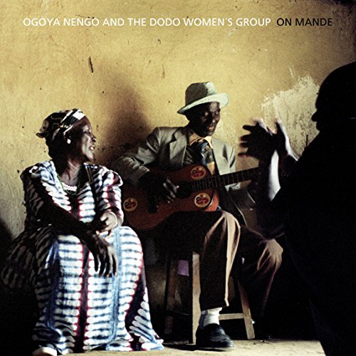 "Album cover with man playing guitar and two people in traditional clothing."