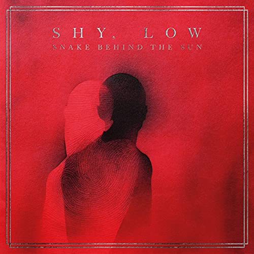 Red album cover featuring a silhouetted figure with textured overlay.