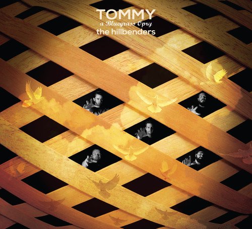 "CD cover with wooden slats, black squares, and black-and-white photos, titled 'Tommy'."