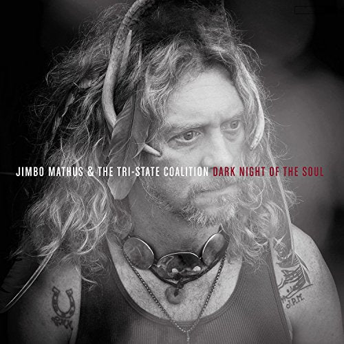 Black and white album cover featuring a man with horns and necklaces.