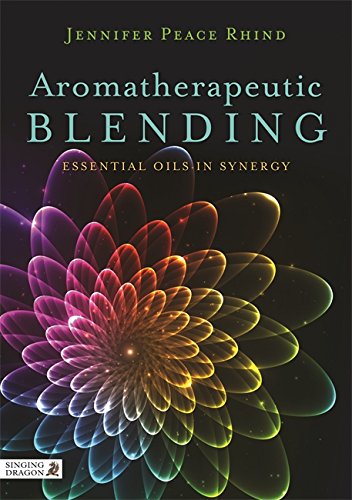 The alt text for the image is: "Book cover with colorful flower and title 'Aromatherapeutic Blending' on dark background."