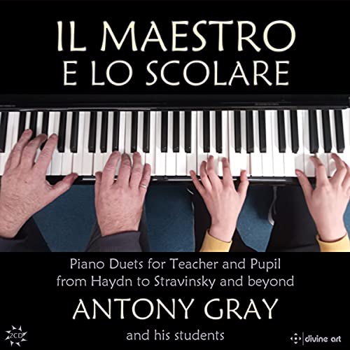 "CD cover showing adult and child hands playing piano together, with white text on black background."