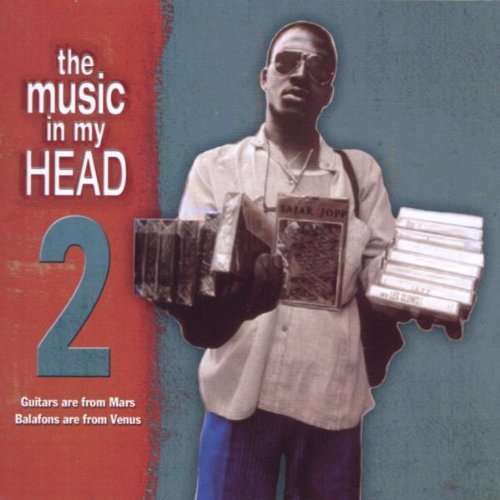 Album cover with man holding CDs, red and blue background, white text.