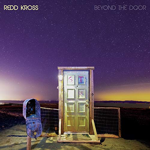 Album cover: a weathered door stands in a starry, desolate landscape.