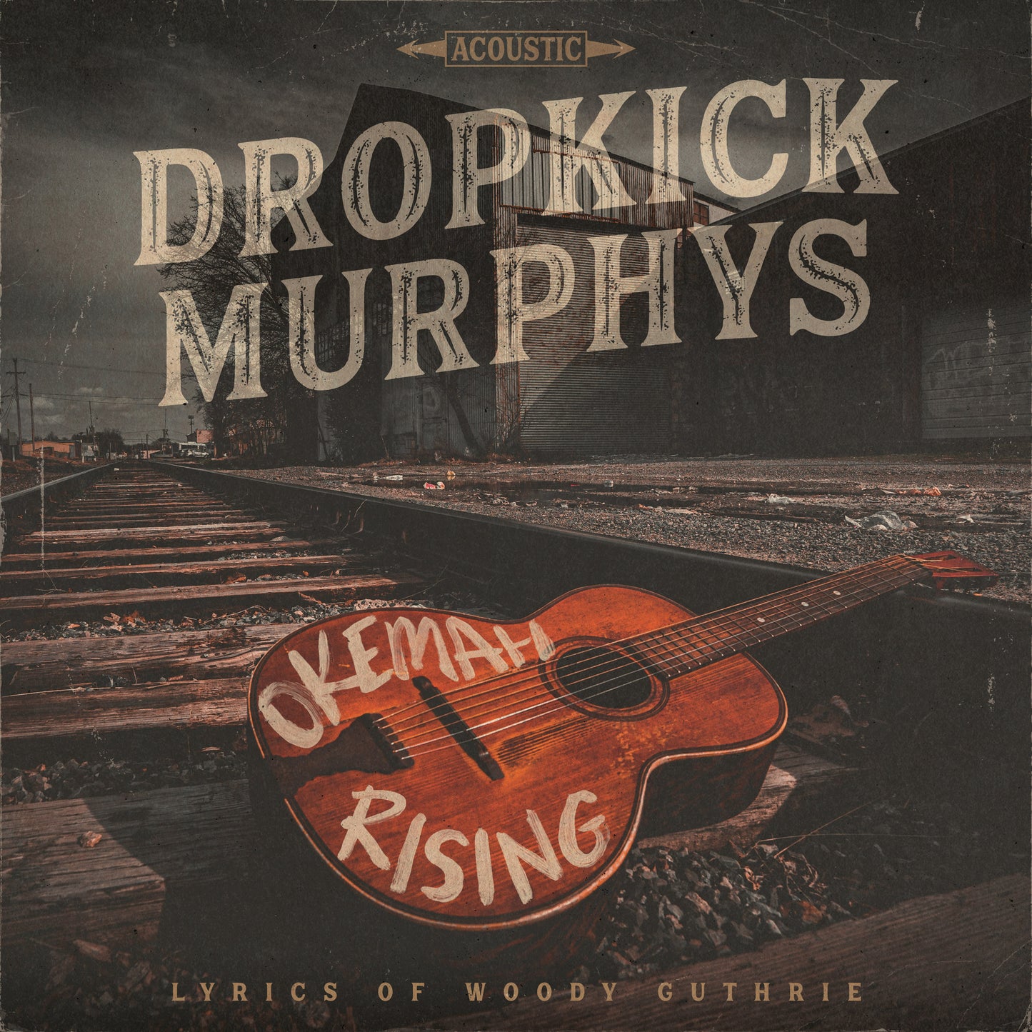 Dropkick Murphys "Okemah Rising" CD cover with guitar and railroad tracks.