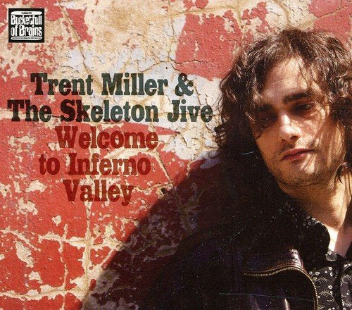 Album cover with man against red, cracked wall, text "Trent Miller & The Skeleton Jive".