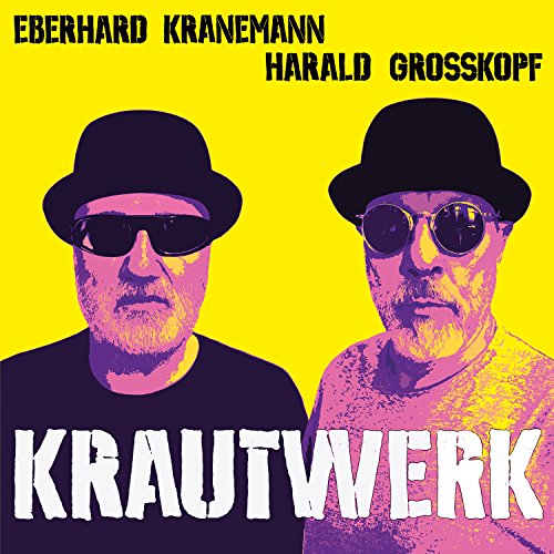 Album cover with two men wearing hats and sunglasses against a yellow background.