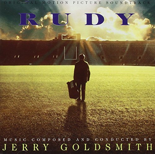 "Soundtrack cover for 'Rudy' with a man walking on a football field."
