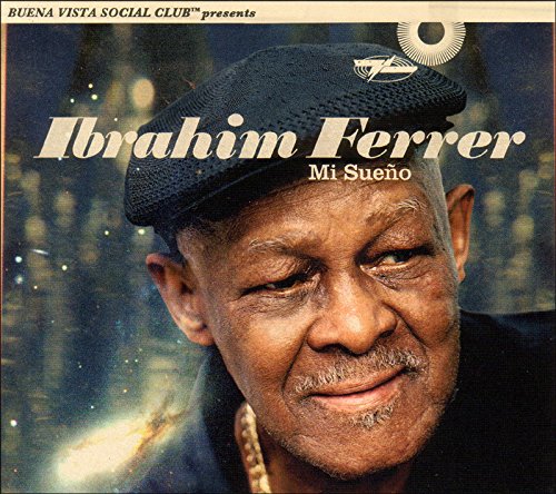 "CD cover featuring a man in a black cap and jacket, smiling."