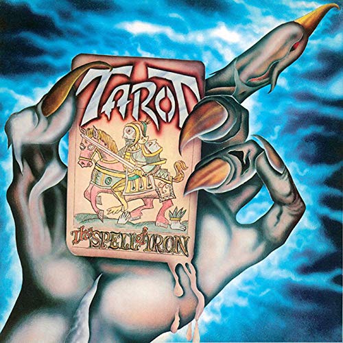 Album cover for Tarot’s “The Spell Of Iron” featuring a hand holding a tarot card.