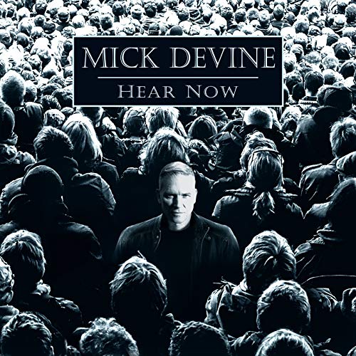 CD cover: Mick Devine portrait amidst a blurred crowd of people.