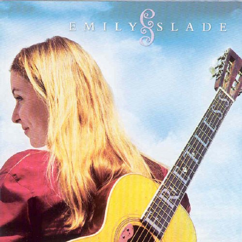 Album cover featuring a blonde woman holding a yellow acoustic guitar against a blue sky.