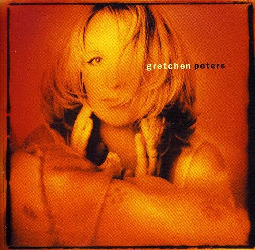 Album cover with a woman's portrait, orange-toned, and the artist's name "Gretchen Peters".