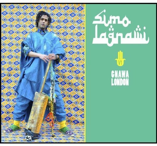 "CD cover with a man holding a stringed instrument, against a patterned background."