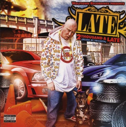 A man stands between two cars with a dog, on a CD cover.