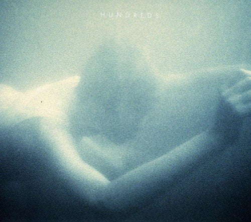 CD cover for “Hundreds” with a blurred, abstract blue image.
