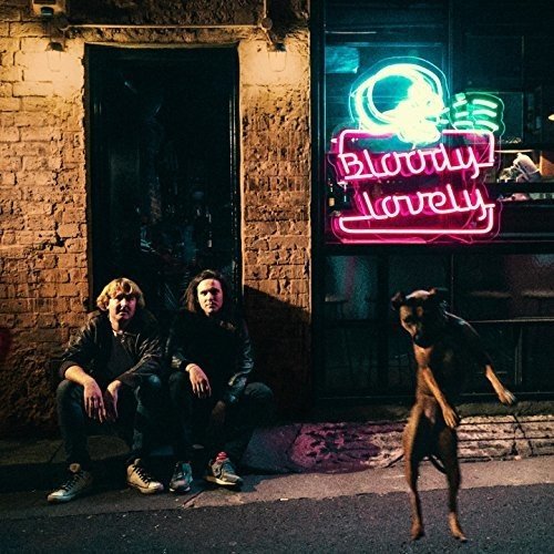 Album cover: two men crouch beside a neon sign reading "bloody lovely" with a dog.