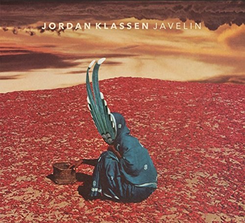 Vinyl record cover featuring a person kneeling in a field of red flowers.