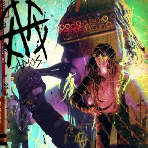 A music CD cover featuring a person behind a wire mesh, with graffiti text.