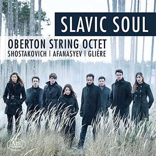 A CD cover featuring eight musicians in black standing in a misty forest.