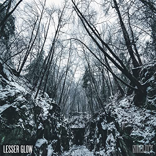 Snowy forest path leading to darkness, album cover for Lesser Glow’s Nullity.