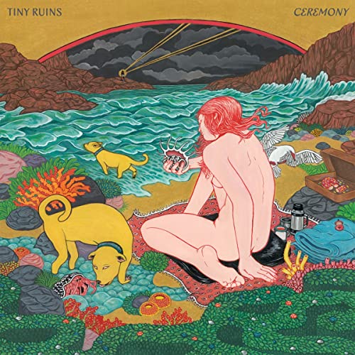 Album cover for Tiny Ruins’ “Ceremony” featuring a person and dogs by the sea.