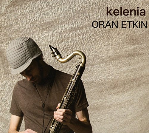 Oran Etkin album cover featuring a saxophonist and cap.
