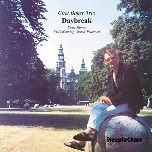 Chet Baker Trio Daybreak vinyl album cover featuring Chet Baker sitting on a rock outdoors.