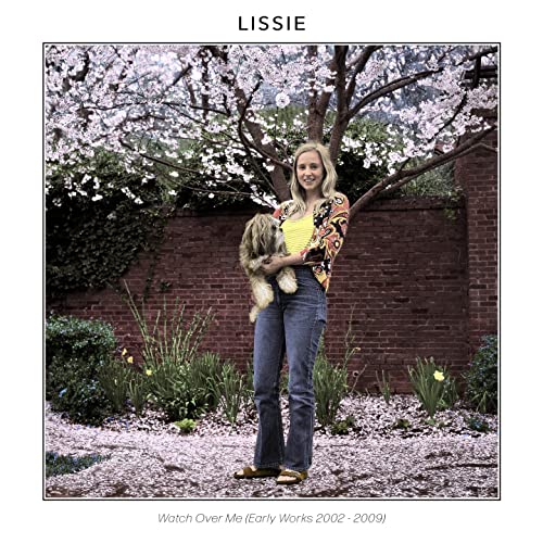 Lissie album cover with artist and dog under flowering tree.