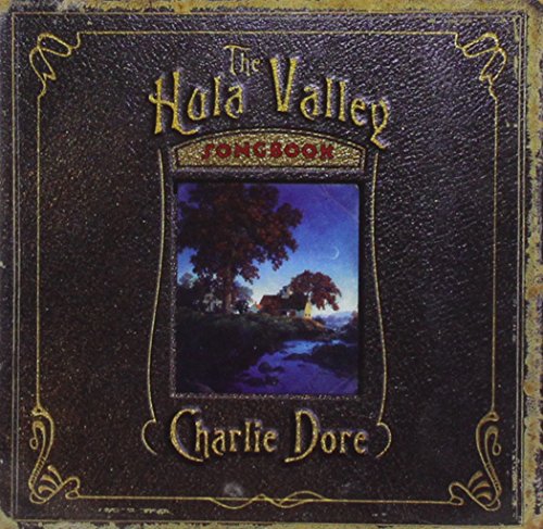 "Album cover with black leather design, gold text, and a scenic nighttime landscape image."