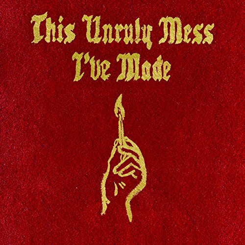 Red album cover with gold text and a hand holding a torch.