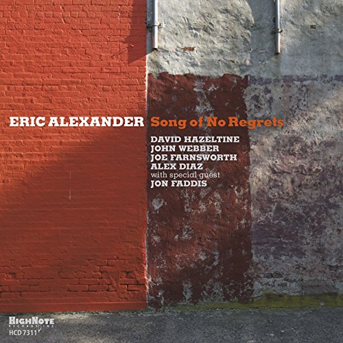 "Album cover with red and gray brick wall background and white and orange text."