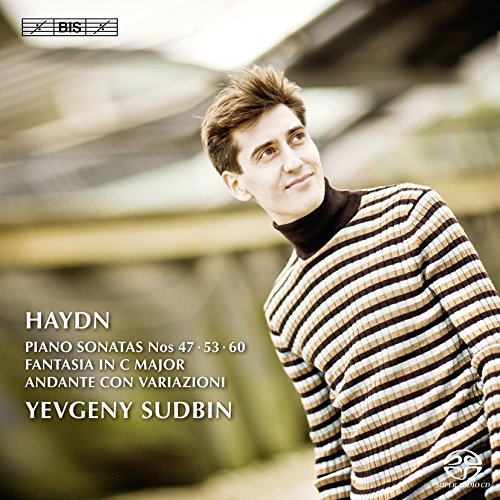 The image shows a CD cover. #### Alt text: Blue abstract CD cover with white and red text and Amazon logo.