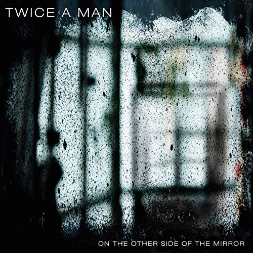 CD cover for “Twice A Man” with a distorted, mirrored face image.