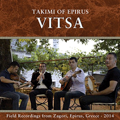 "CD cover featuring four men playing traditional instruments outdoors."