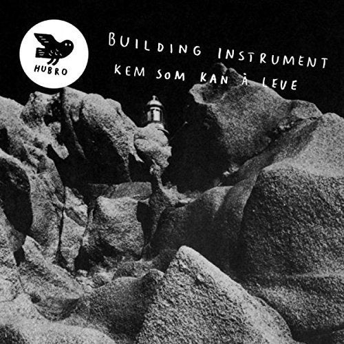 Black and white vinyl record cover with a rocky landscape and lighthouse.