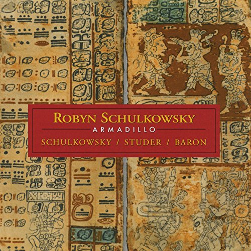 "CD cover with Mayan-inspired artwork and red label featuring artist names in gold text."