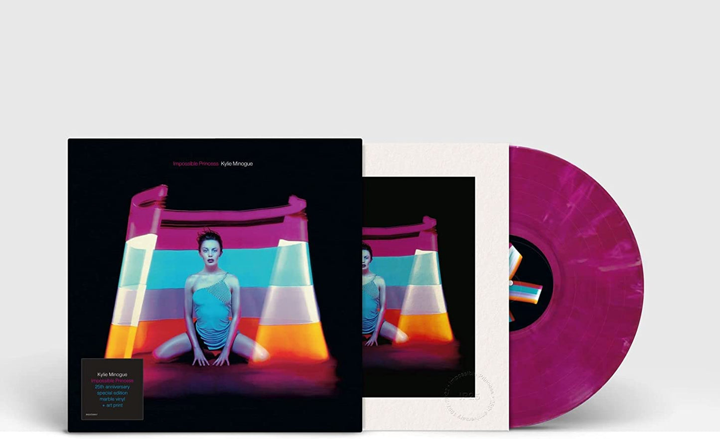 Kylie Minogue sits in a rainbow-lit arch, wearing a blue dress, on a vinyl album cover.