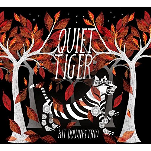 "Album cover art featuring a tiger surrounded by trees with red leaves against a black background."