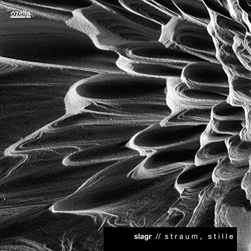 Abstract black and white image of layered rock formations, CD cover.