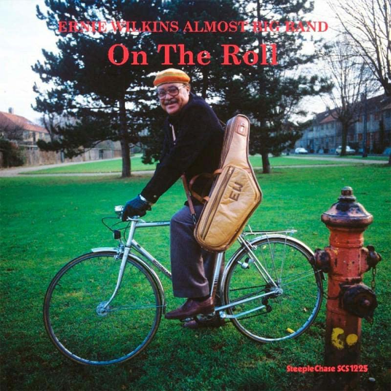 Ernie Wilkins album cover: man with trombone and bicycle on grass.