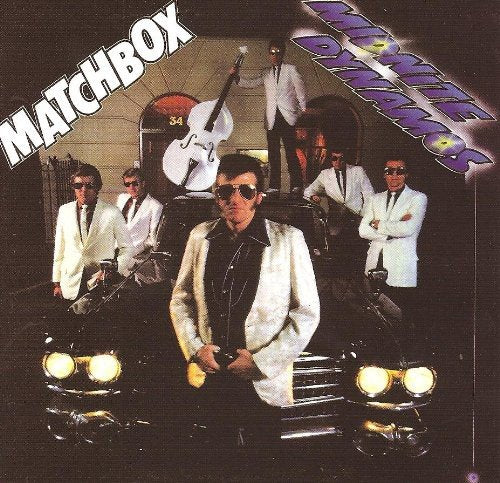 "Album cover featuring five men in white suits posing around a black car."