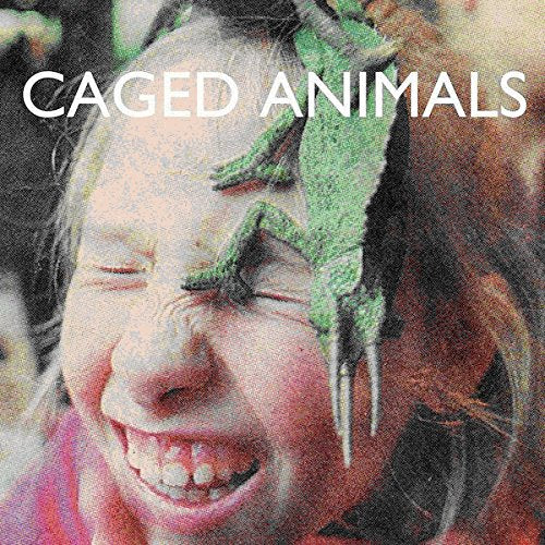 Vinyl album cover featuring a child’s face with lizards on it.
