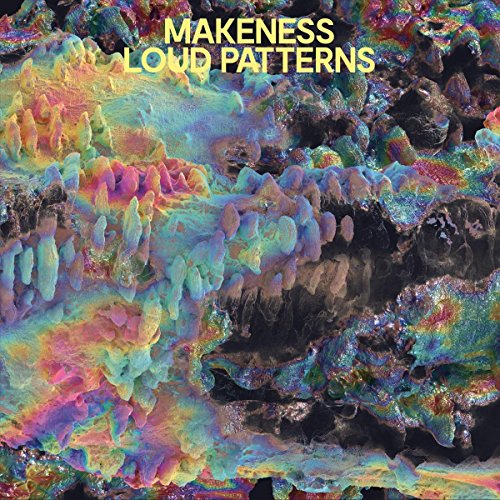 Vinyl album cover with iridescent, rainbow-colored abstract design and yellow text "Makeness Loud Patterns".
