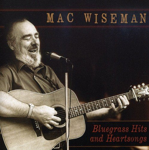 "Album cover with Mac Wiseman playing guitar and singing into a microphone."
